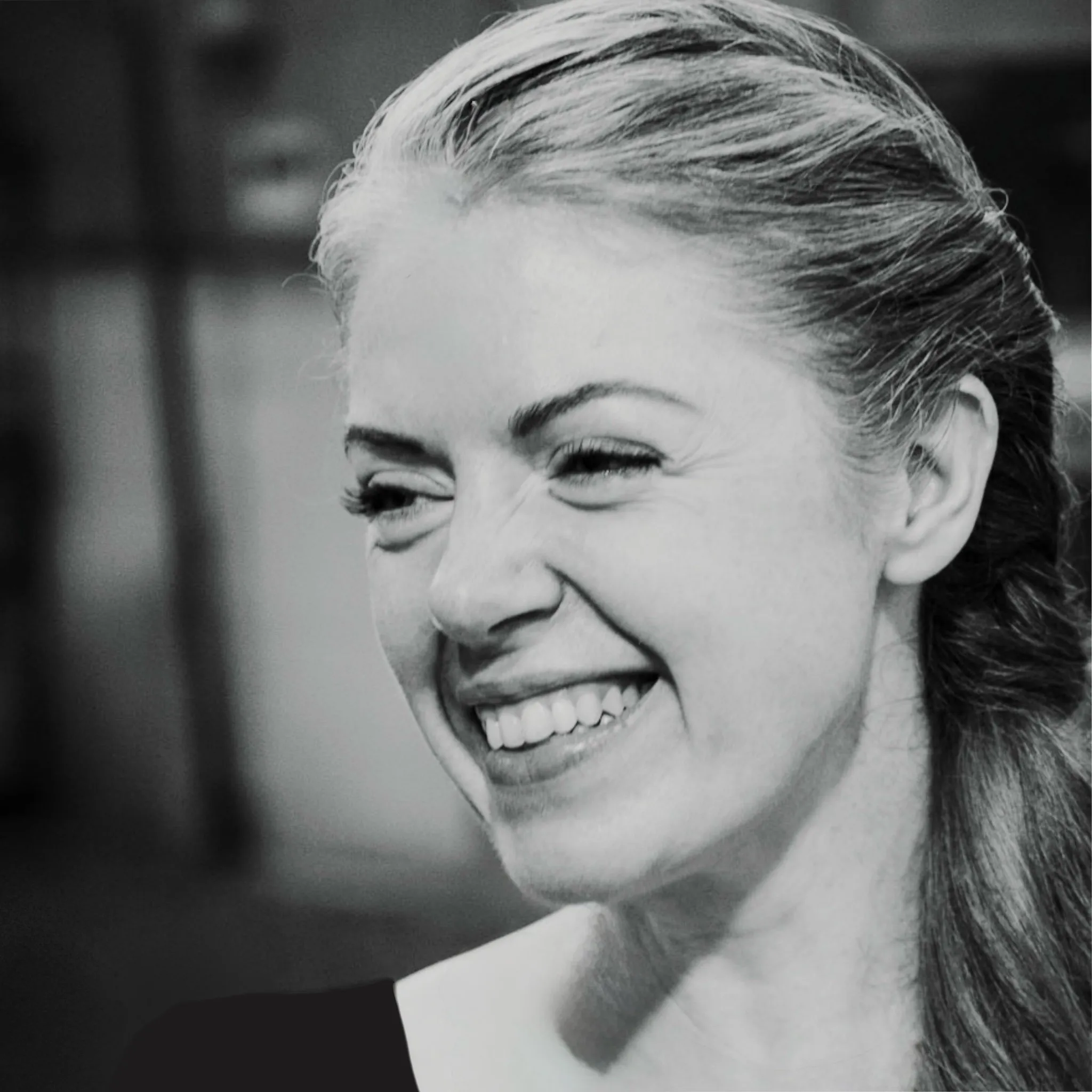 Shelley Earl, smiling, in black and white